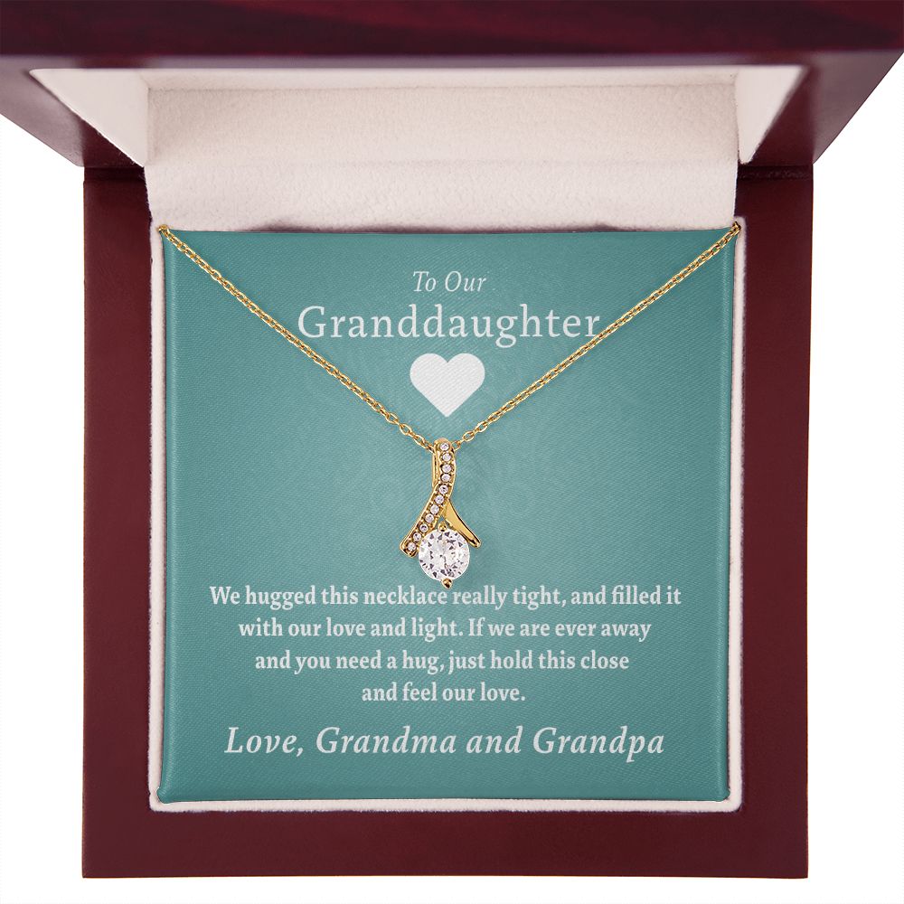 To Our Granddaughter - Feel Our Love ( Grandma and Grandpa) | Stainless Steel and Gold Ribbon Necklace