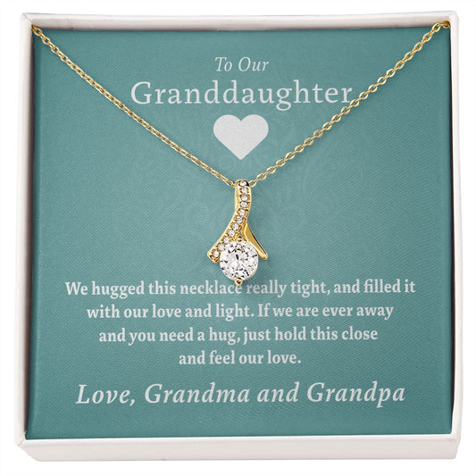 To Our Granddaughter - Feel Our Love ( Grandma and Grandpa) | Stainless Steel and Gold Ribbon Necklace