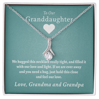 To Our Granddaughter - Feel Our Love ( Grandma and Grandpa) | Stainless Steel and Gold Ribbon Necklace