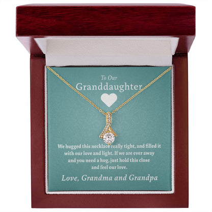 To Our Granddaughter - Feel Our Love ( Grandma and Grandpa) | Stainless Steel and Gold Ribbon Necklace