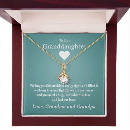 To Our Granddaughter - Feel Our Love ( Grandma and Grandpa) | Stainless Steel and Gold Ribbon Necklace