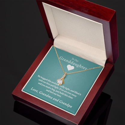 To Our Granddaughter - Feel Our Love ( Grandma and Grandpa) | Stainless Steel and Gold Ribbon Necklace