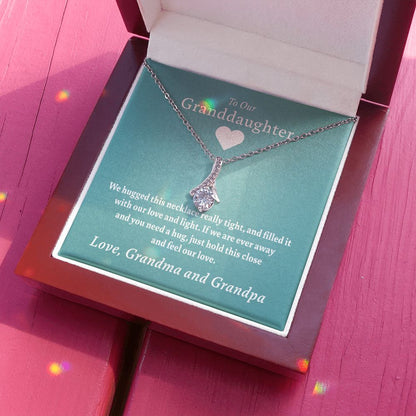 To Our Granddaughter - Feel Our Love ( Grandma and Grandpa) | Stainless Steel and Gold Ribbon Necklace